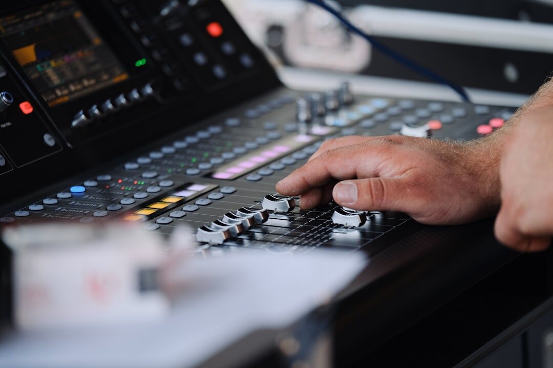 Technical director monitoring broadcast energy flow on a vision mixing desk